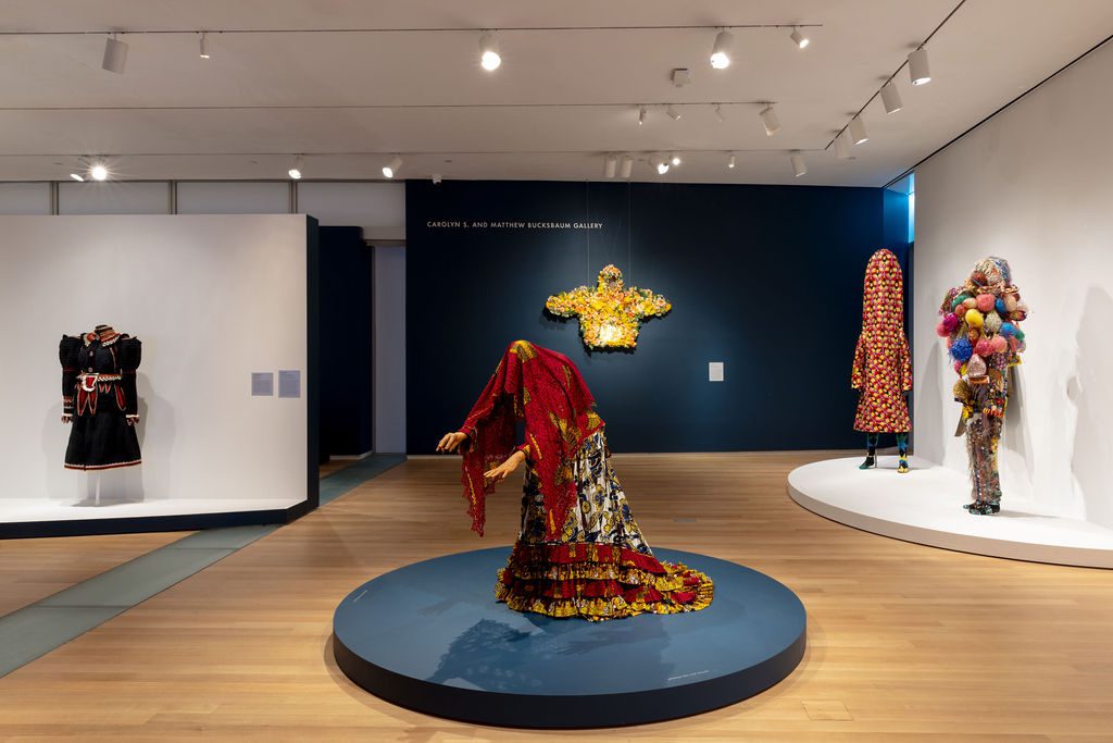 Installation view of "Garmenting: Costume as Contemporary Art" at Museum of Arts and Design featuring Devan Shimoyama's February II.